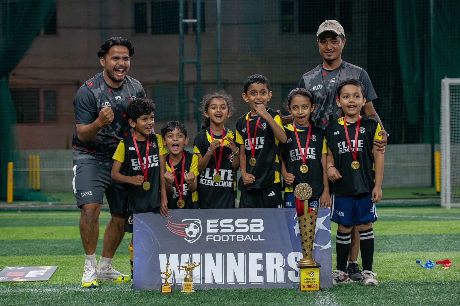 ESSB school team celebrating a tournament win