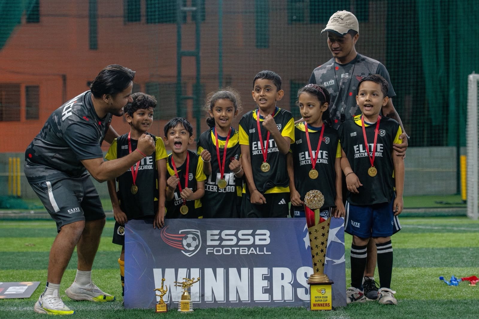 ESSB school team celebrating a tournament win