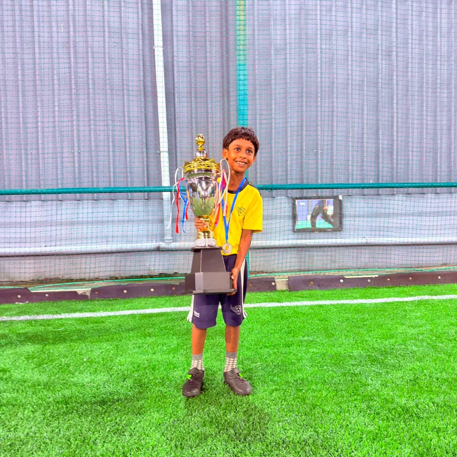 Young ESSB player with a tournament trophy