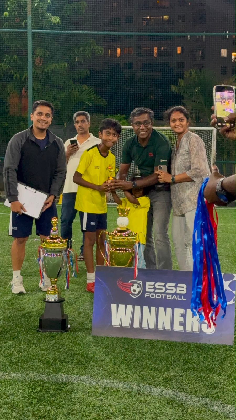 ESSB school team celebrating a tournament win