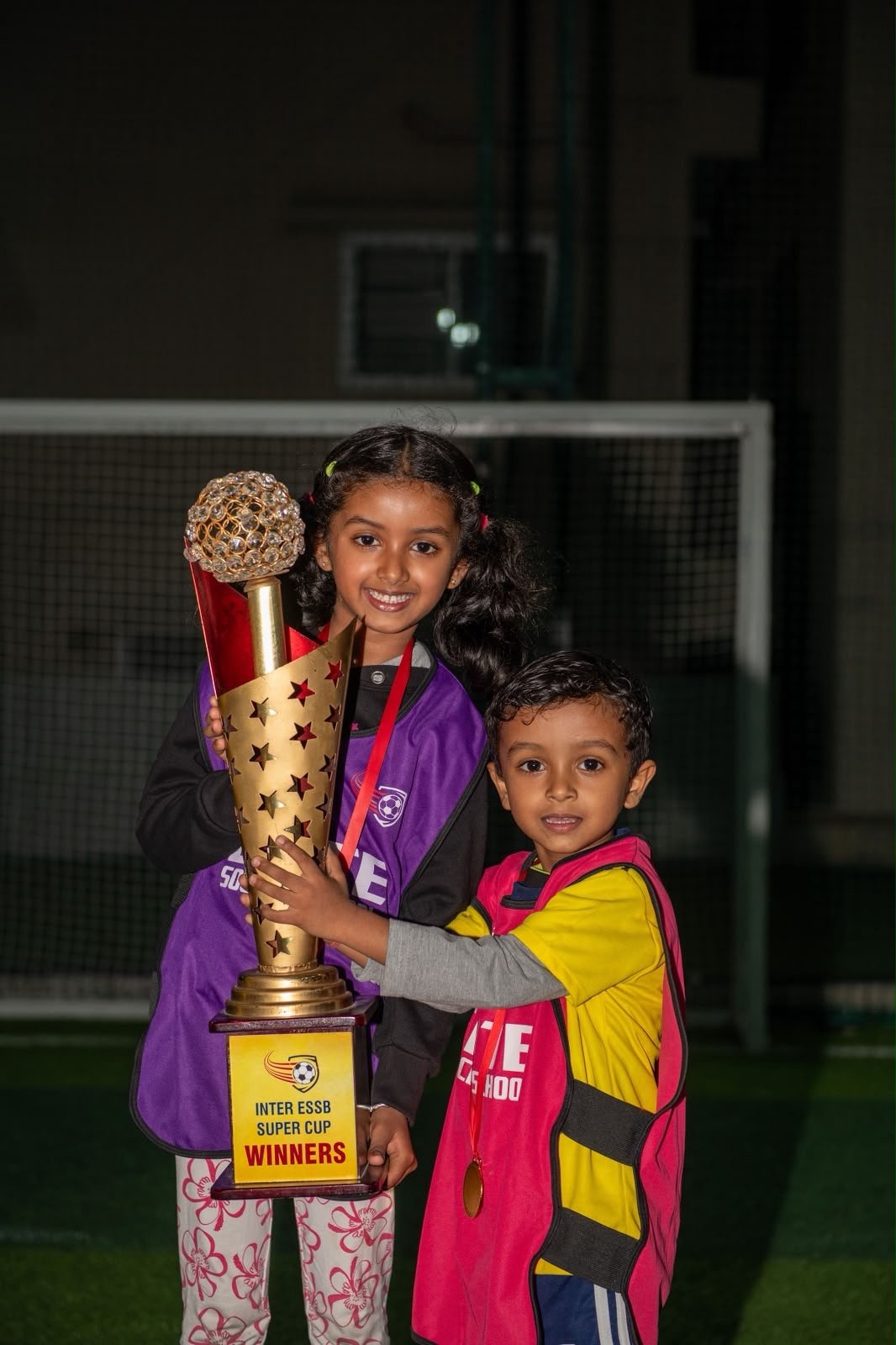 Young ESSB player with a tournament trophy