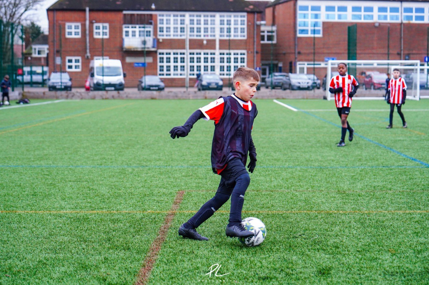 A player dribbling during a London training session